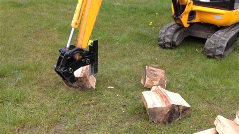 splitting wood with mini excavator|mini excavator log splitter attachment.